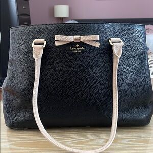 Black Kate Spade tote with pink bow